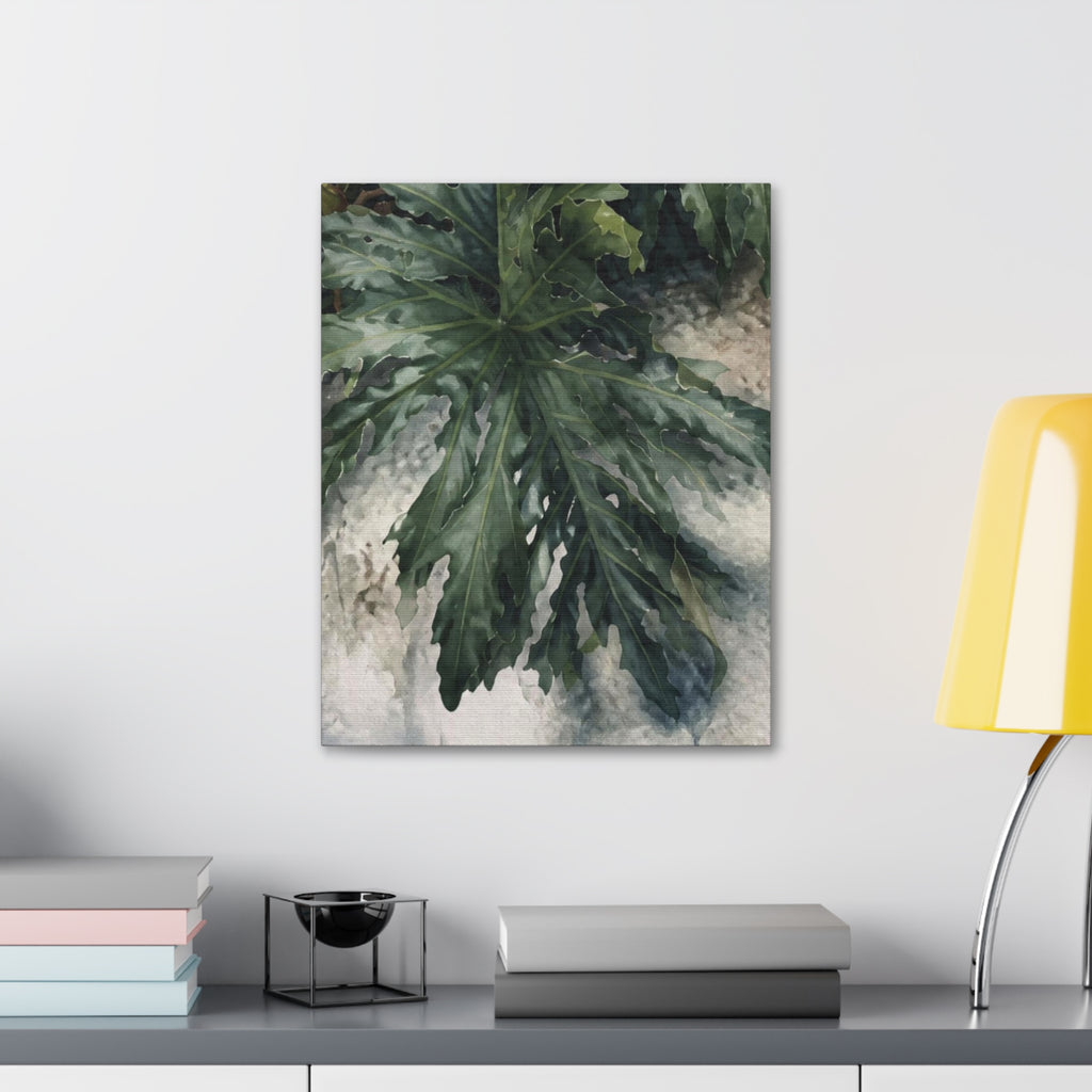  A Little Wild botanical canvas above a gray cabinet styled with books and a yellow table lamp.