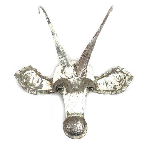 A rustic metal sable head wall mount with textured, distressed silver and white paint, featuring long curved horns and small side ears, shown against a plain white background.