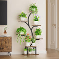 7-tier tree-shaped plant stand styled with lush indoor plants in a warm living room