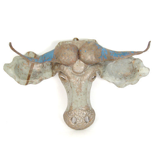 Wildebeest head wall sculpture handcrafted from reclaimed tin with patinated blue-grey finish, wide sweeping horns, and textured surface — African-inspired statement wall art