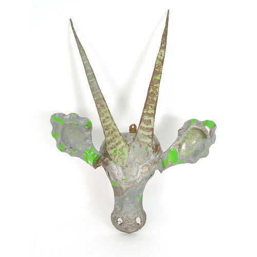 A rustic metal sable head wall mount with textured, distressed silver and white paint, featuring long curved horns and small side ears, shown against a plain white background.